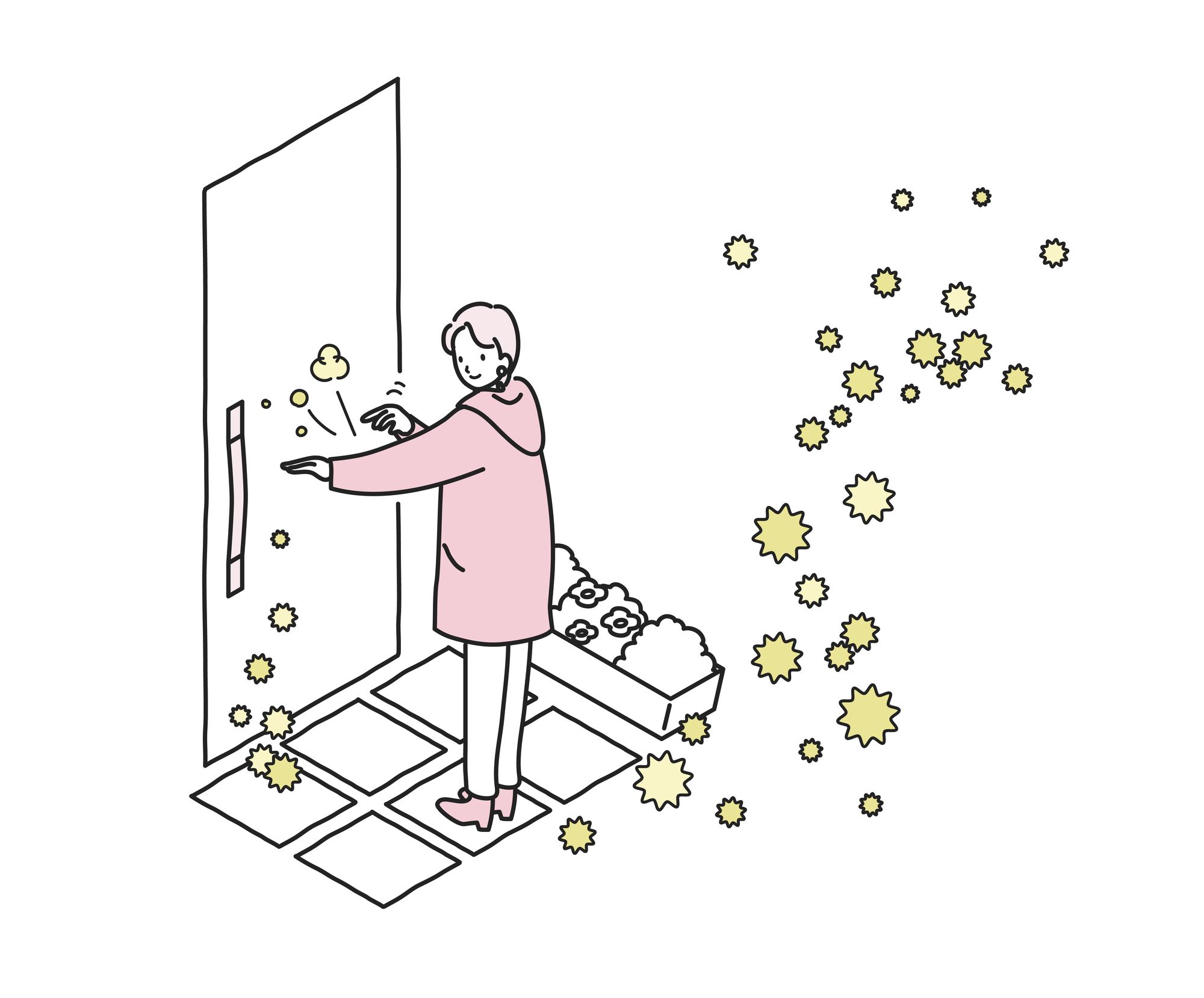玄関で花粉を払い落とす女性